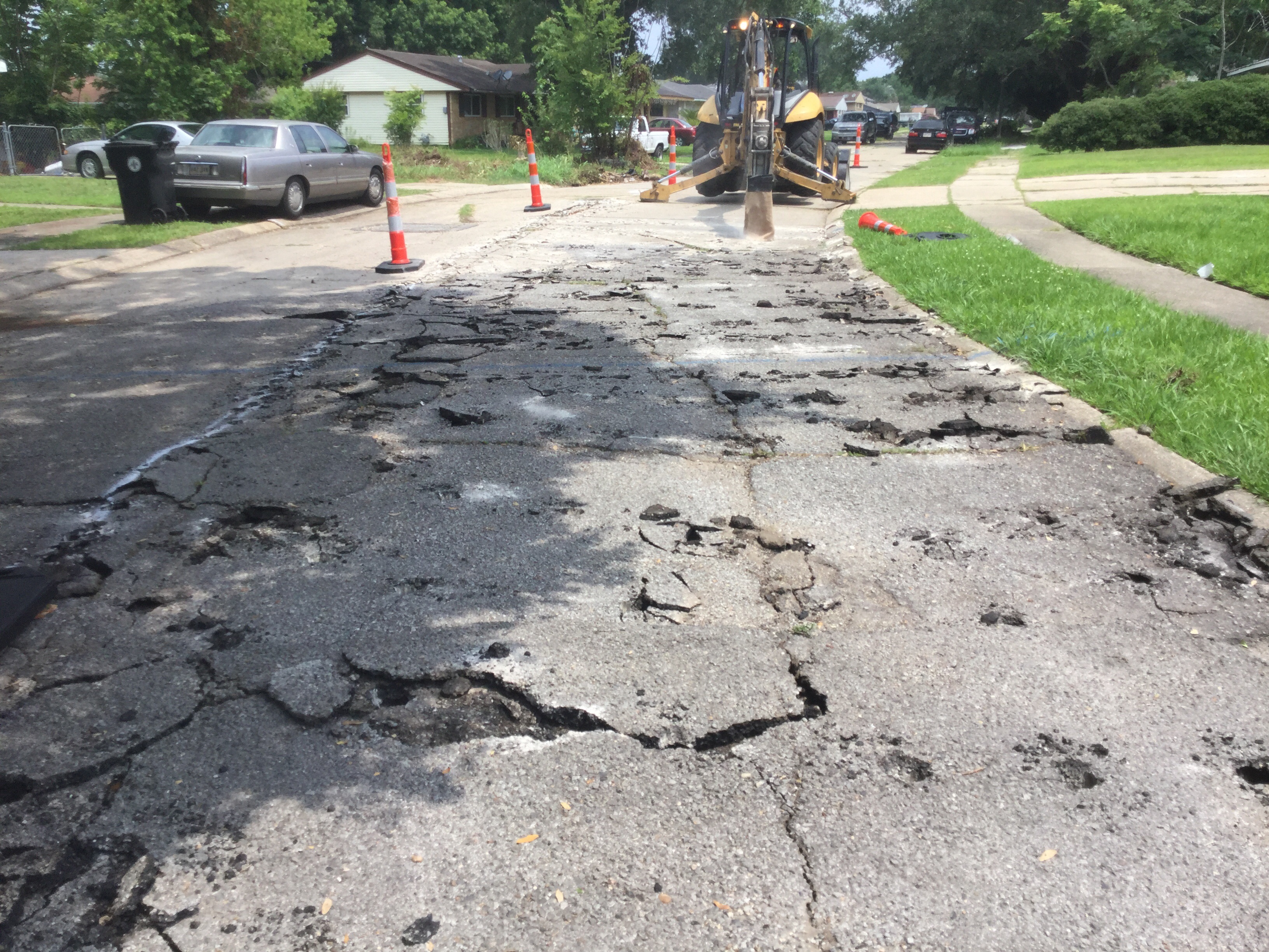 CONSTRUCTION CREWS BEGIN BREAKING UP EXISTING PAVEMENT ON PITTARI STREET IN NEW AURORA