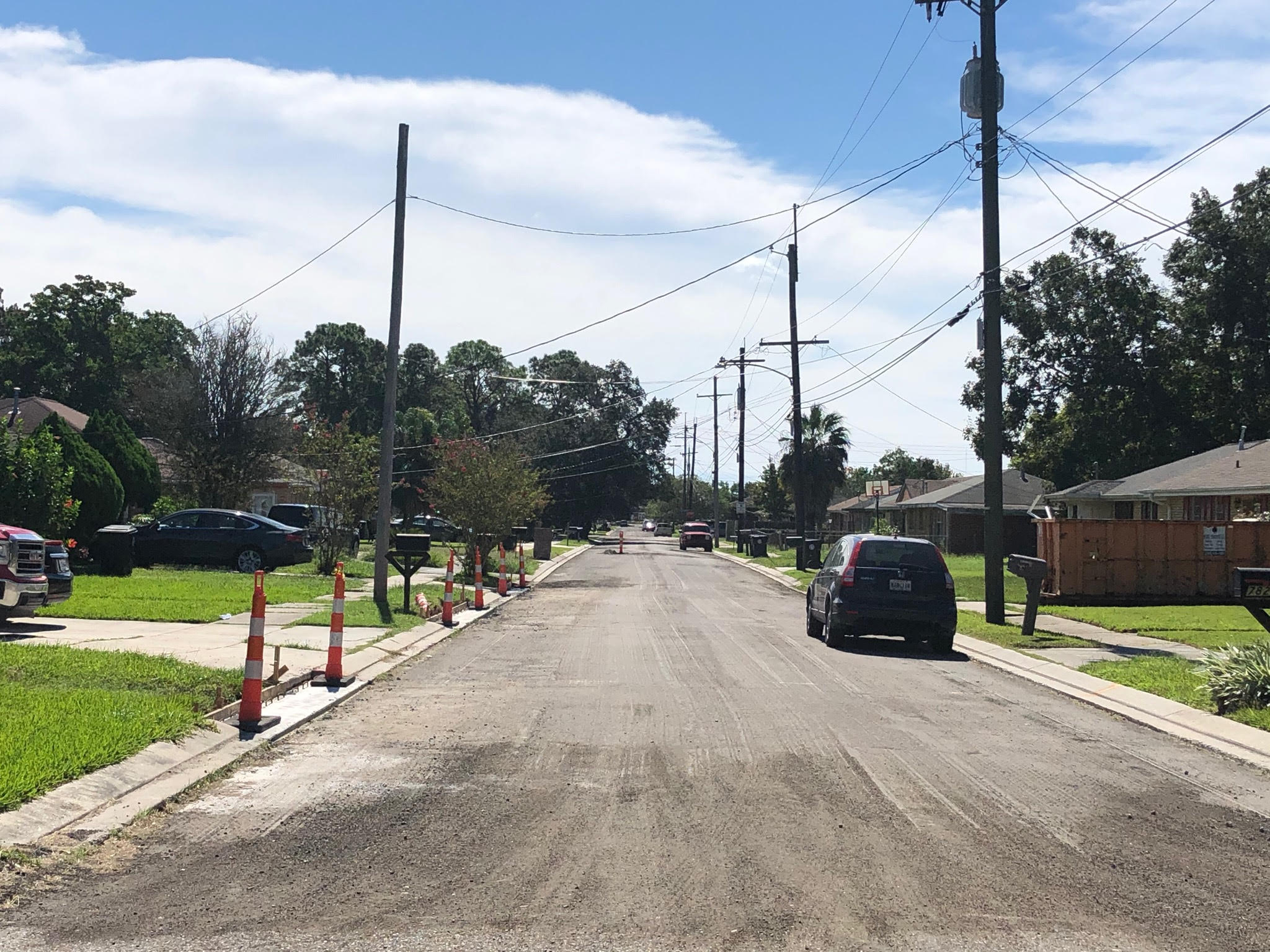 CREWS WORK TO RE-PAVE ALL OPEN AREAS ON LITTLE WOODS GROUP A PROJECT