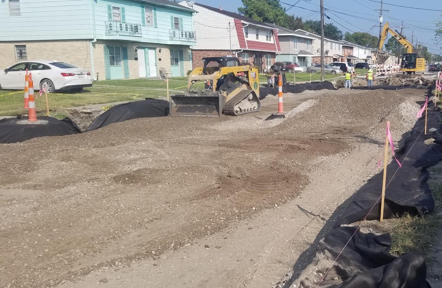 CREWS ARE FINISHING WATER LINES AND DRAIN LINES IN PINES VILLAGE GROUP B PROJECT